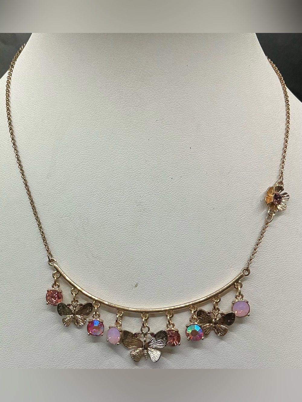 BETSEY JOHNSON GOLDTONE ARC BAR BUTTERFLY RHINESTONE FLORAL CHARM NECKLACE